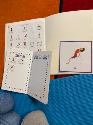 Sticker book open to Zoom In section with Camel pose card and stickers