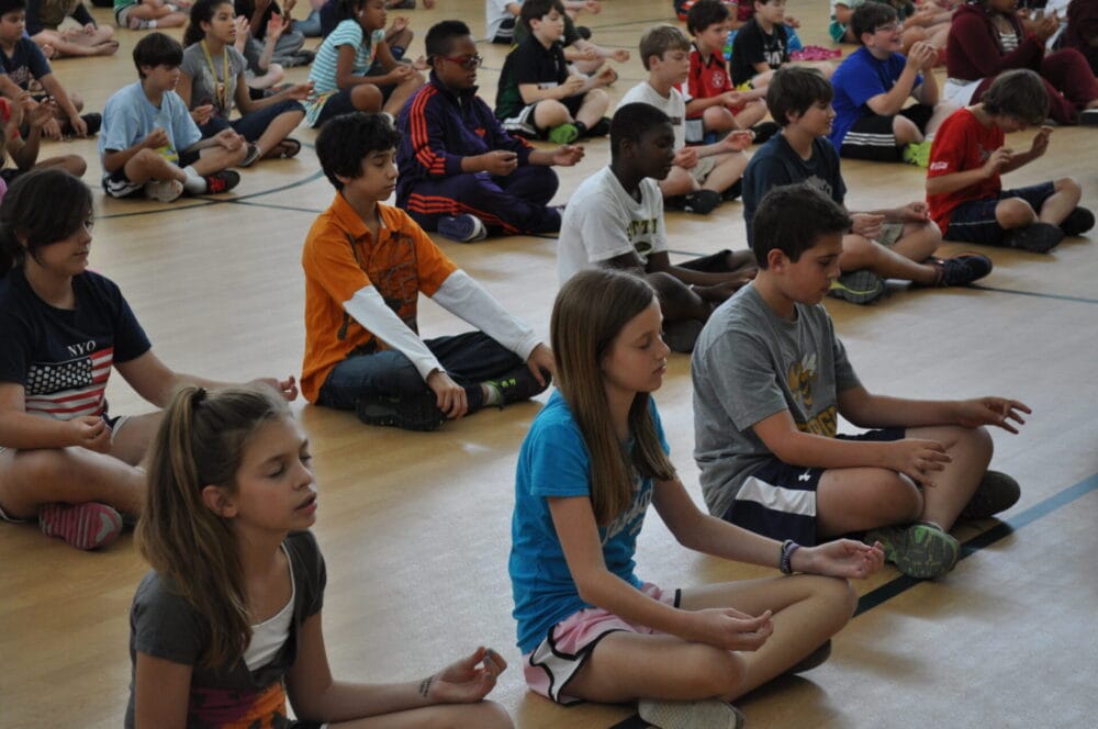 Child practicing yoga in Grounded Kids Yoga class