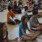 Child practicing yoga in Grounded Kids Yoga class