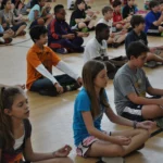 Child practicing yoga in Grounded Kids Yoga class