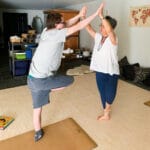 Jacob in a focused pose during a Grounded Kids Yoga class, showing calm concentration