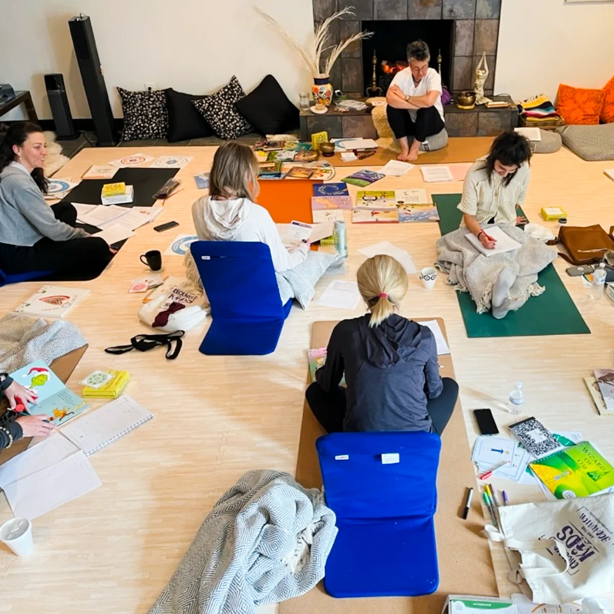 This image shows Step 3 Teacher Training of Grounded Kids Yoga teacher training in progress, where participants explore child development through the chakra system, deepen their understanding of energetic patterns, and begin to design teaching materials rooted in structure, visuals, and emotional fluency.