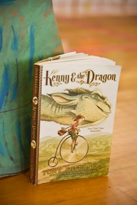 The book Kenny & the Dragon by Tony DiTerlizzi standing on a table