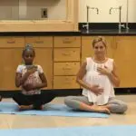 Grounded Kids Yoga teacher training participants in a summer intensive practicing poses together